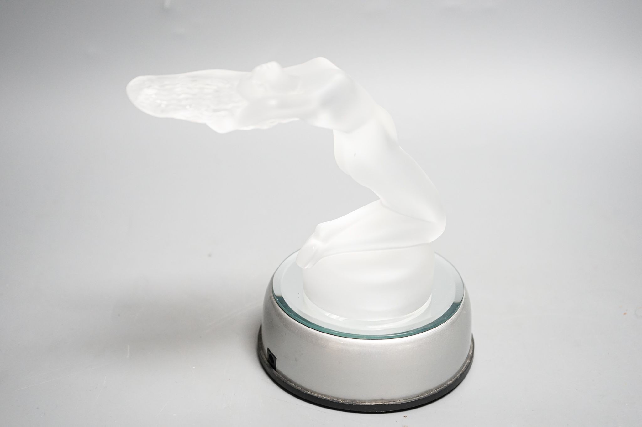A post war Lalique Chrysis clear frosted glass paperweight or car mascot, with light up base. 13cm excl base